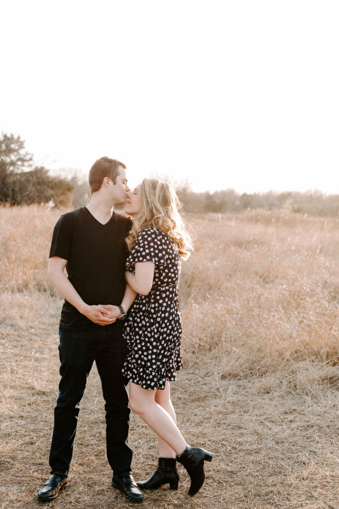 field couple session at golden hour